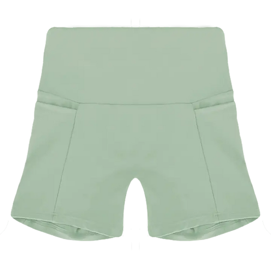 A flat lay image of the Allawah Shorts in the colour Moss, showcasing side pockets and a seamless front