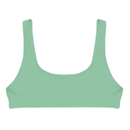 A flat lay image of our sporty style swim top Lowanna in the colour Pistachio